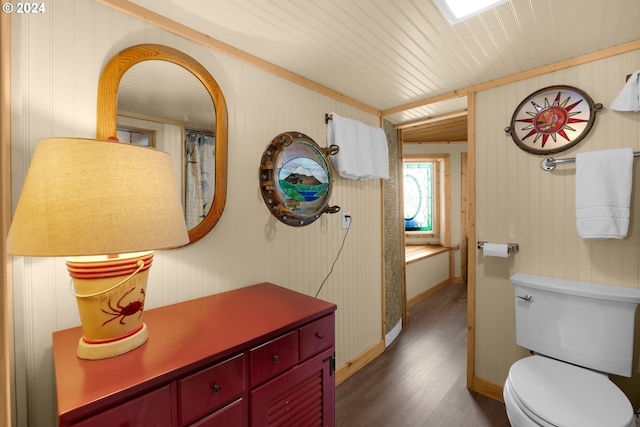 bathroom with wooden walls, hardwood / wood-style flooring, toilet, and wood ceiling