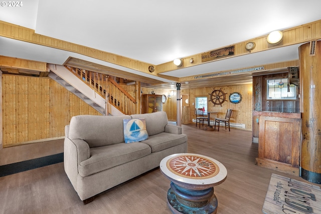 living room featuring wood walls and dark wood-type flooring