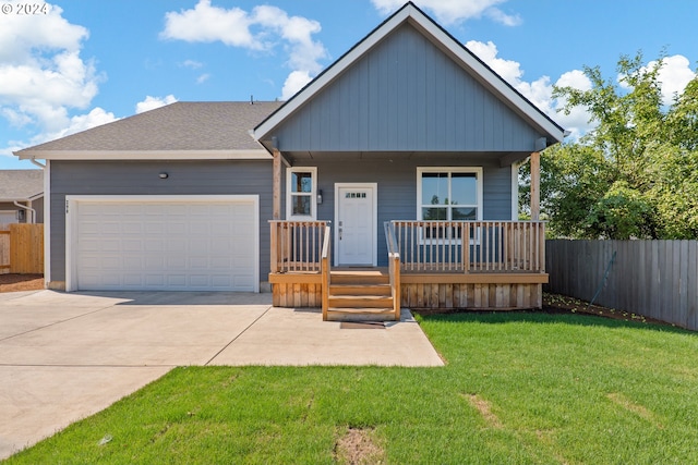 view of front of home featuring a garage and a front lawn