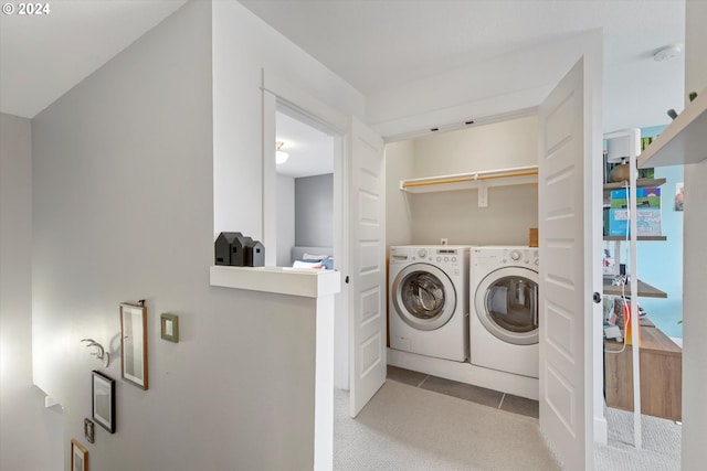 washroom featuring light carpet and independent washer and dryer