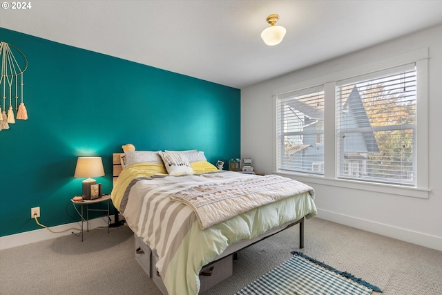 carpeted bedroom with multiple windows