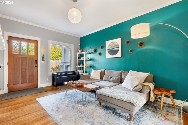 living room with hardwood / wood-style flooring and ornamental molding