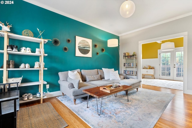 living room with ornamental molding and hardwood / wood-style floors