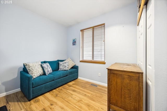 sitting room featuring hardwood / wood-style flooring