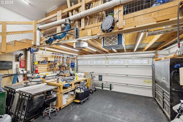 garage with a workshop area and a garage door opener