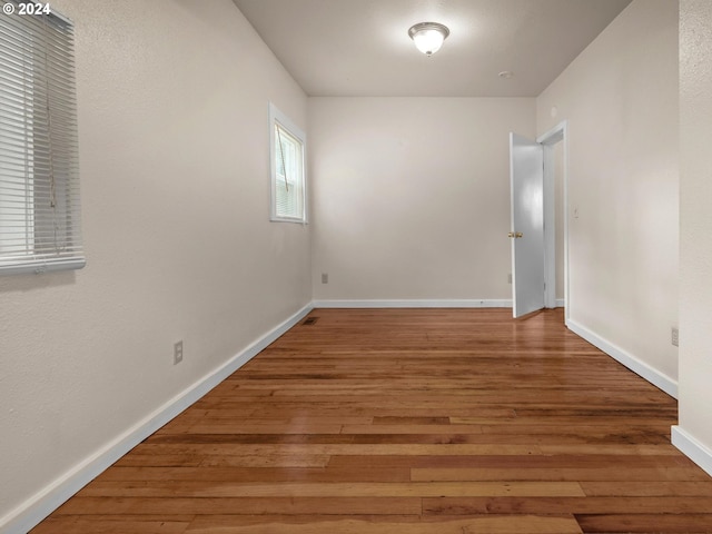 empty room featuring hardwood / wood-style flooring