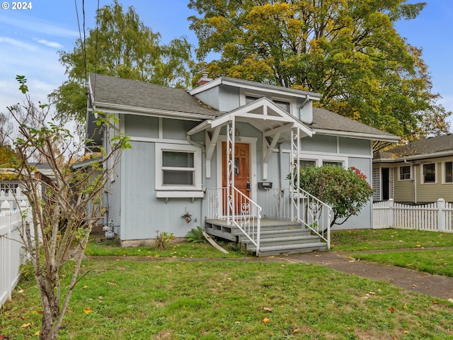 view of front of home with a front yard