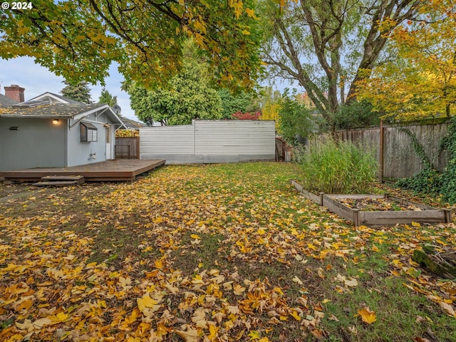 view of yard with a wooden deck