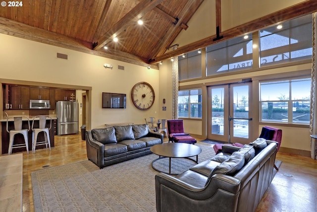 living room featuring beamed ceiling, wood ceiling, high vaulted ceiling, and french doors