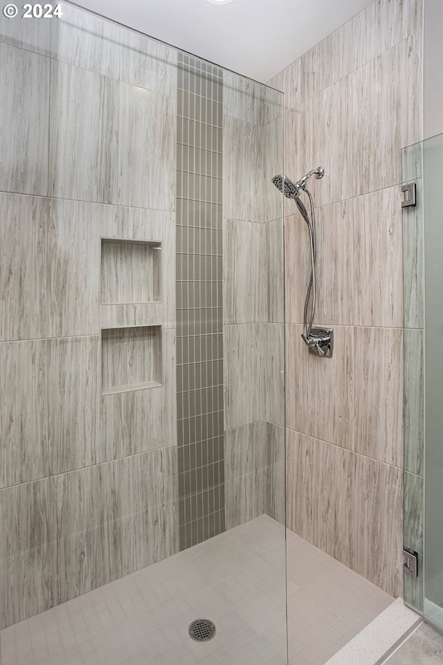 bathroom with a shower stall