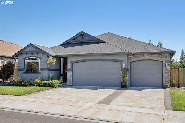 ranch-style house with a front yard and a garage