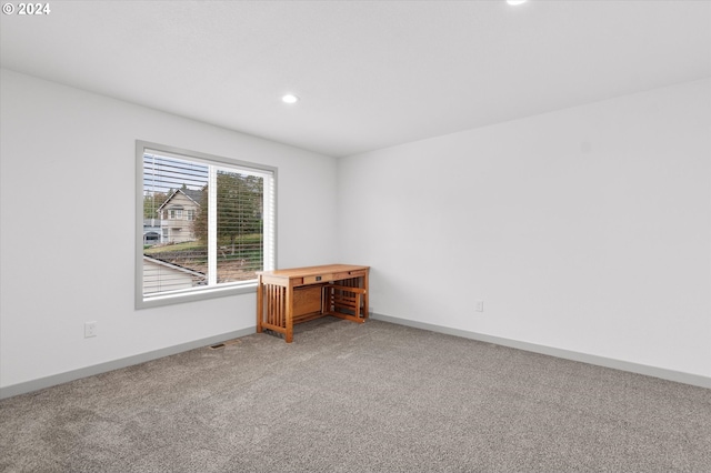 empty room featuring carpet flooring