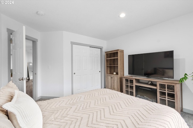 bedroom with carpet floors and a closet