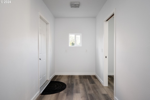 corridor featuring dark hardwood / wood-style flooring