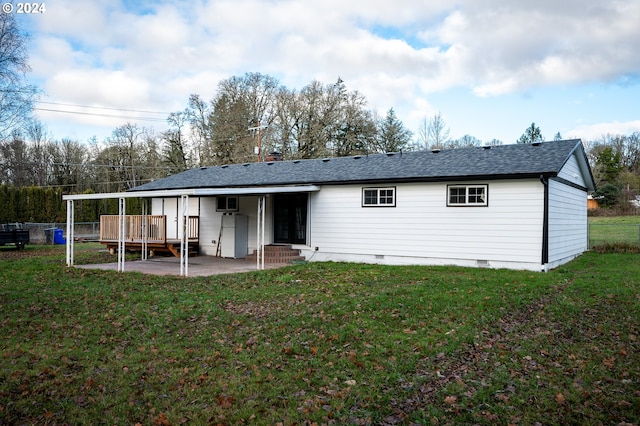 rear view of property with a lawn and a patio area