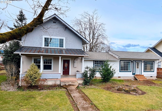 view of front of house featuring a front yard, crawl space, metal roof, and a standing seam roof