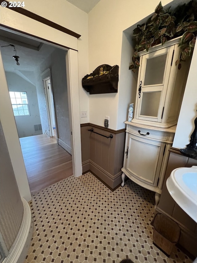 bathroom featuring wainscoting and visible vents