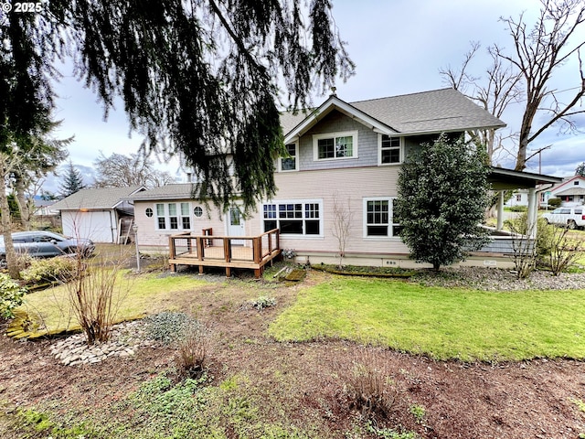 rear view of property featuring a lawn and a wooden deck