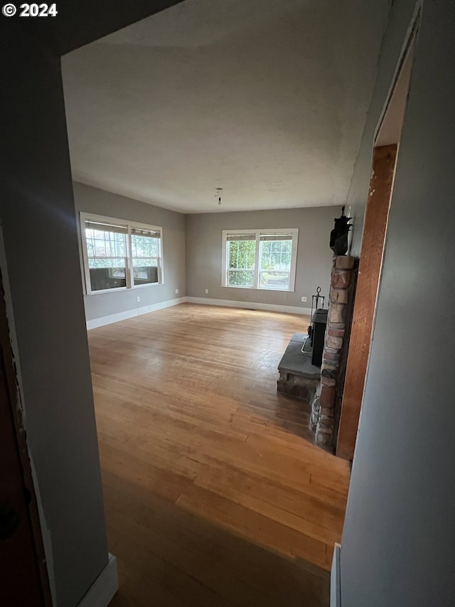 living room with baseboards and wood finished floors