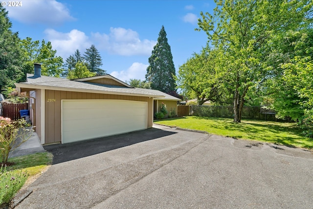 garage with a yard