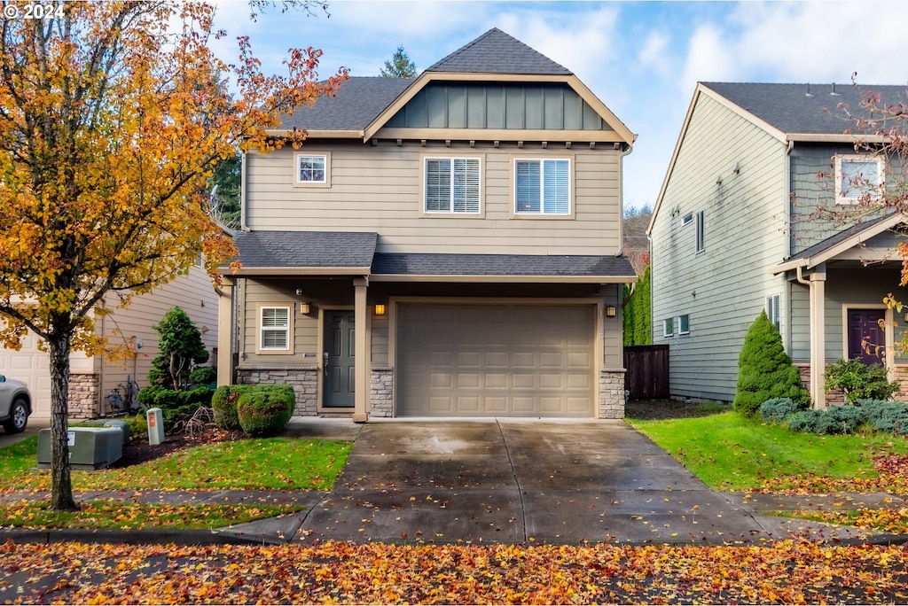 craftsman-style home with a garage