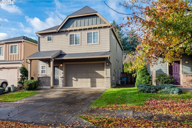 craftsman-style house with a garage and central AC unit