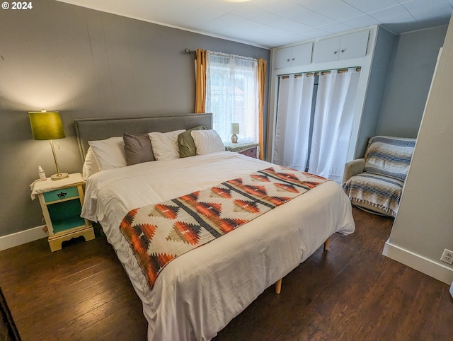 bedroom featuring dark hardwood / wood-style flooring