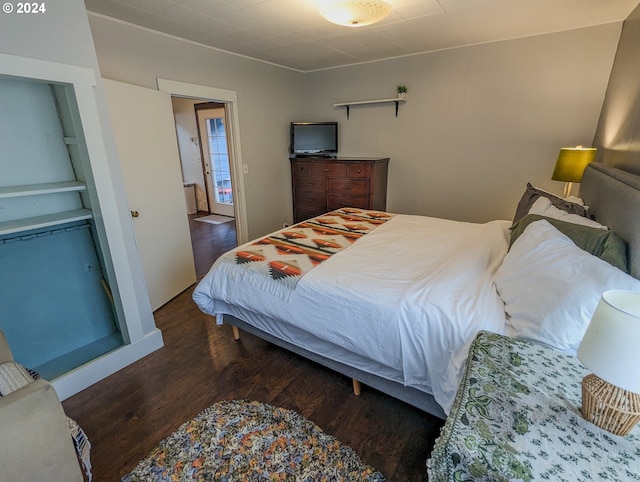 bedroom featuring wood finished floors