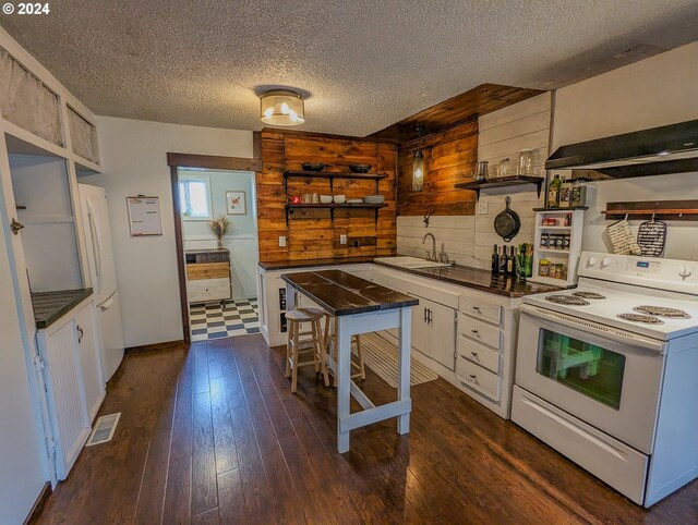 kitchen with white cabinetry, dark wood-type flooring, white appliances, a textured ceiling, and sink