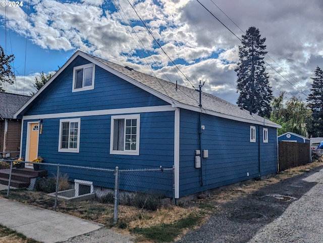 view of property exterior featuring fence