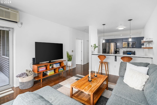 living room with an AC wall unit and dark wood-type flooring