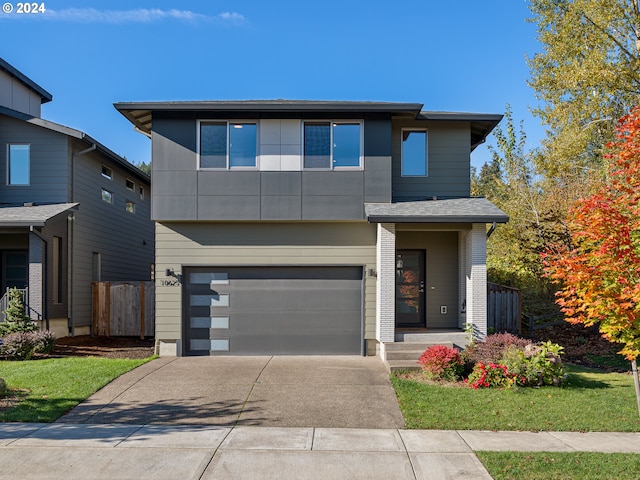 modern home with a garage and a front yard