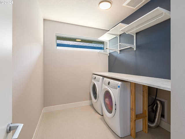 washroom with washer and clothes dryer