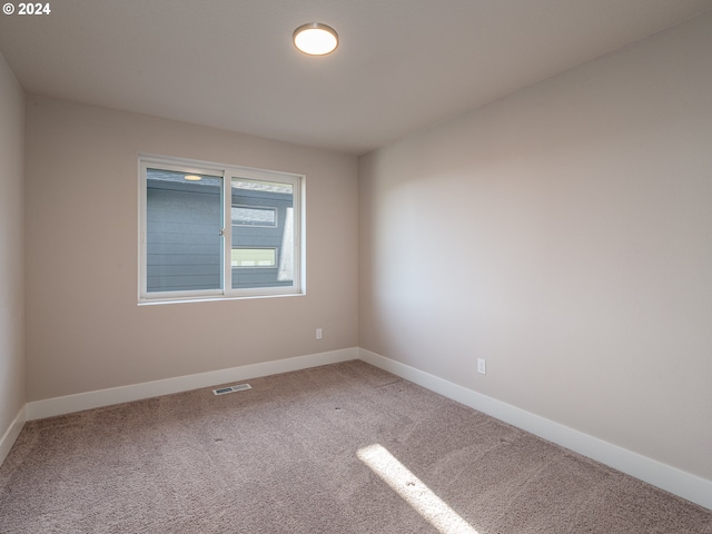 spare room with carpet flooring