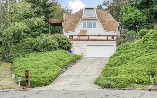 2626 NW 83rd Pl, Portland, OR 97229 - view of front of home featuring a shingled roof, concrete driveway, a garage, and a balcony