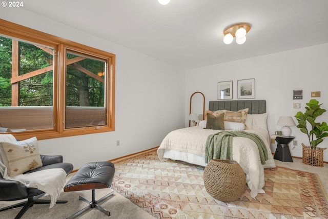 carpeted bedroom with baseboards