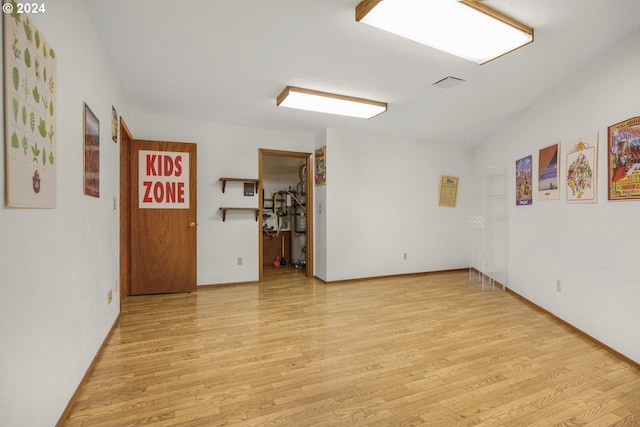 spare room with visible vents and light wood-type flooring