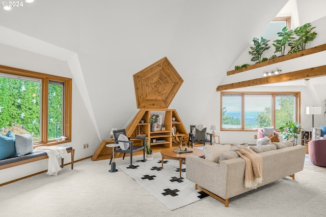 living area featuring baseboards, carpet, a healthy amount of sunlight, and a towering ceiling