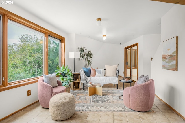 living room with tile patterned floors and baseboards