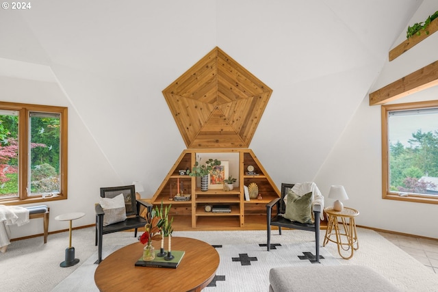 2626 NW 83rd Pl, Portland, OR 97229 - living room featuring vaulted ceiling, plenty of natural light, and baseboards