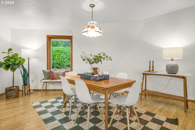 dining room with baseboards and wood finished floors