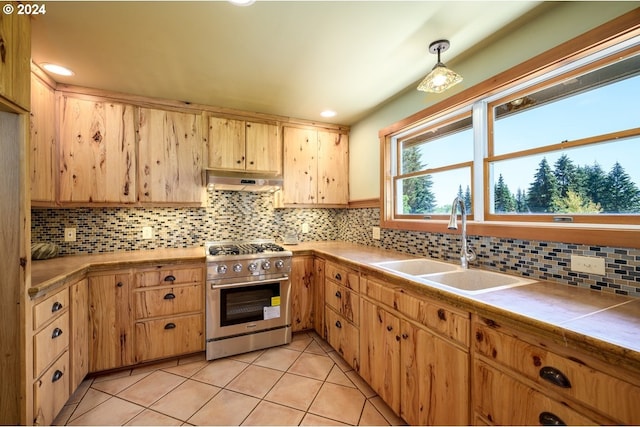 26231 SW Thunderhead Ln, Sheridan, OR 97378 - kitchen featuring high end range, a sink, light tile patterned floors, backsplash, and recessed lighting