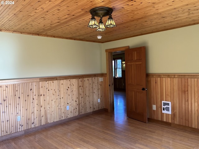 26231 SW Thunderhead Ln, Sheridan, OR 97378 - spare room featuring wainscoting, wood walls, wood finished floors, and wood ceiling