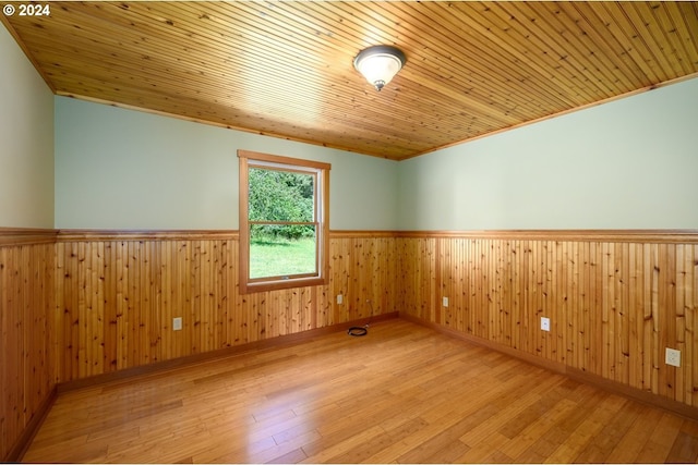 26231 SW Thunderhead Ln, Sheridan, OR 97378 - unfurnished room with wainscoting, wood-type flooring, wood ceiling, and wooden walls
