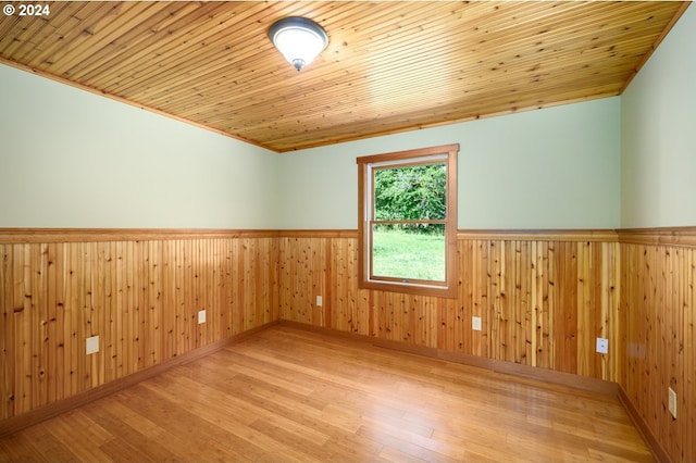 26231 SW Thunderhead Ln, Sheridan, OR 97378 - unfurnished room featuring wainscoting, wood finished floors, wooden ceiling, and wooden walls