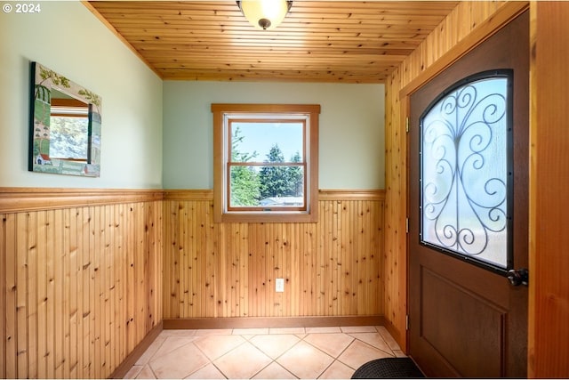 26231 SW Thunderhead Ln, Sheridan, OR 97378 - entrance foyer featuring wainscoting, light tile patterned floors, and wood walls