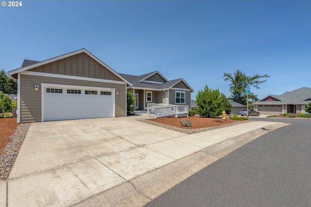 view of front of property featuring a garage and a porch