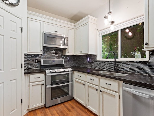 kitchen featuring white cabinetry, sink, and appliances with stainless steel finishes