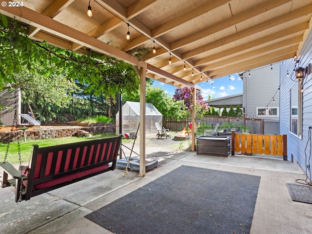 view of patio featuring an outbuilding