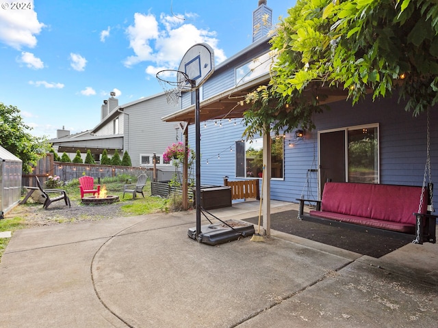 view of patio / terrace featuring an outdoor fire pit